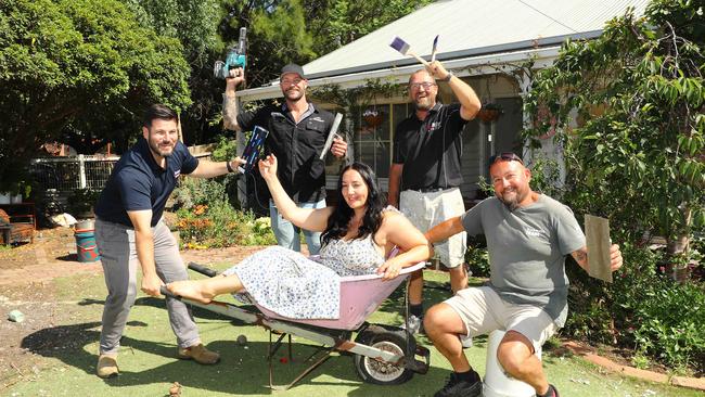 Janelle Bridges with the tradies who helped re-build her house for free from left Mus Erkul Geelong territory manager for Dulux Trade, Anthony Axon director of Axon Plastering, Colin Reid owner of CJ Reid Painting and Charlie Debono from CharlieÃs Mowing and Maintenance. Picture: Alison Wynd