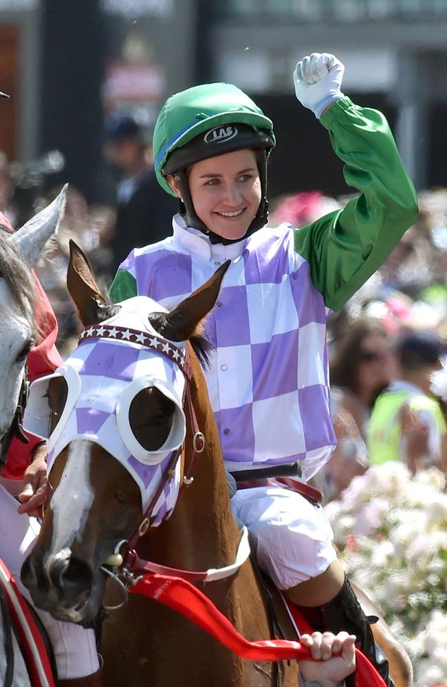 Michelle Payne celebrating after becoming the first female jockey to win the Melbourne Cup last year / AFP