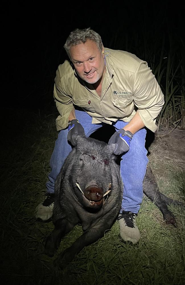 Steve Andrew with the boar that ran at him as he was walking home from checking on a trap. He said the boar weighed 124.2kg. Picture: Supplied