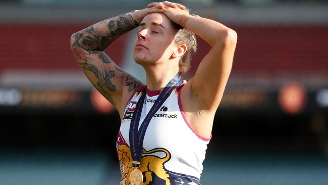 Jessica Wuetschner lets the reality of becoming a premiership player sink in post-game. Picture: Michael Willson/AFL Photos via Getty Images