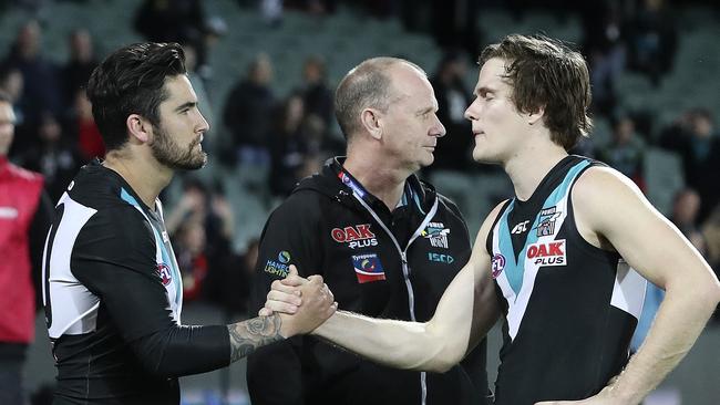 Chad Wingard with the departing Jared Polec and coach Ken Hinkley after Port Adelaide’s final-round loss. Picture Sarah Reed