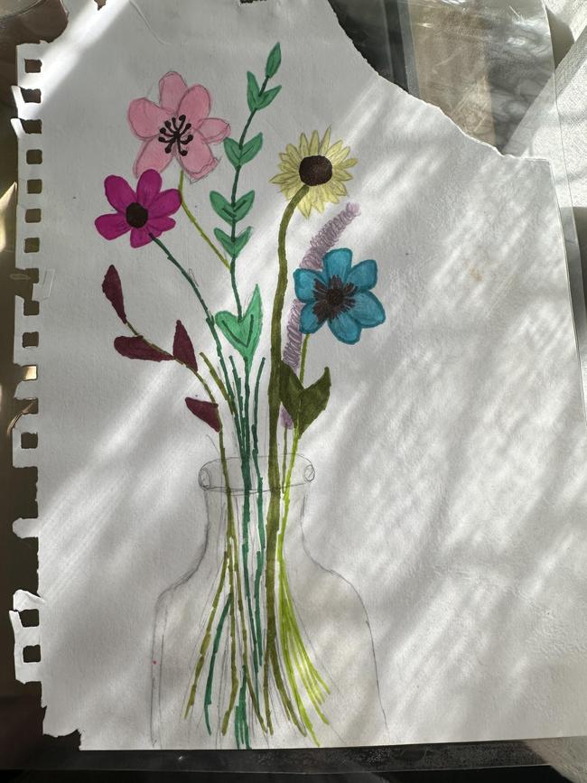 A drawing by Corrine of flowers. Her father had the image tattooed on his arm.