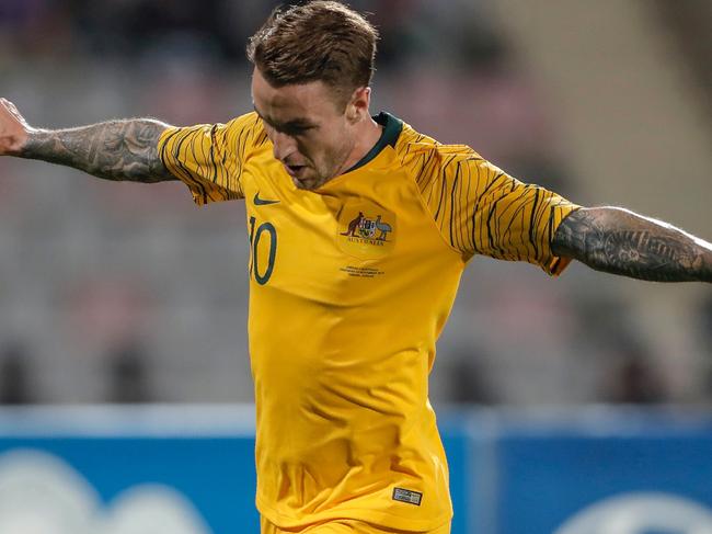 Australia's forward Adam Taggart celebrates his goal during the Group B FIFA World Cup 2022 and the 2023 AFC Asian Cup qualifying football match between Jordan and Australia in the Jordanian capital Amman on November 14, 2019. (Photo by Ahmad ALAMEEN / AFP)