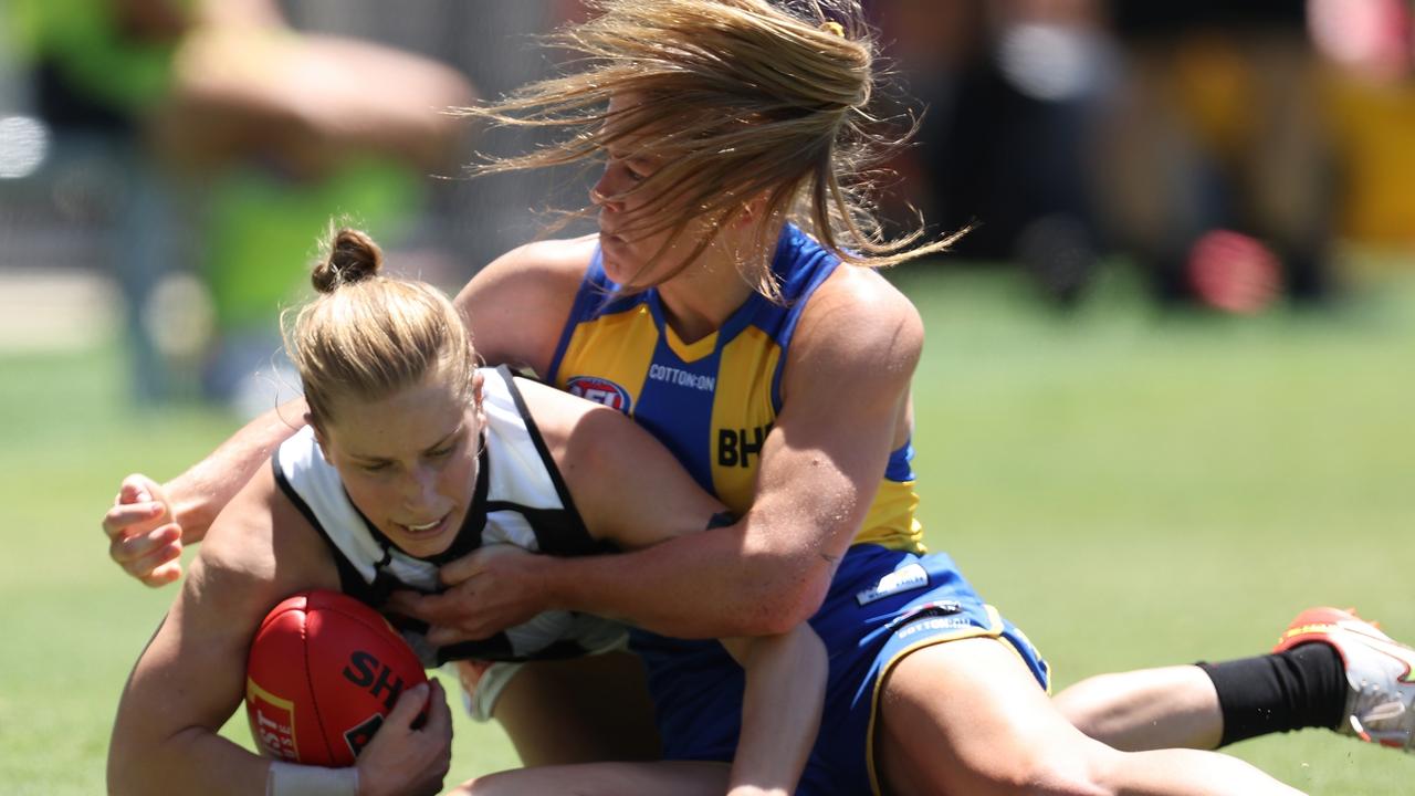 Isabella Lewis tackles Collingwood’s Jaimee Lambert at Mineral Resources Park, Perth. Picture: Getty Images