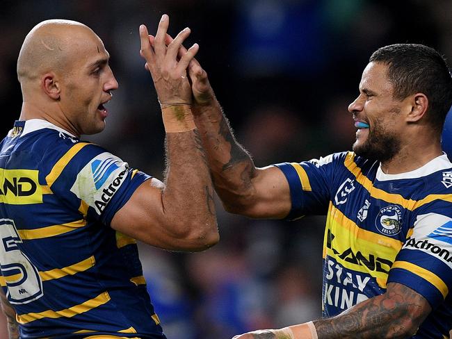 Josh Hoffman of the Eels (right) celebrates with Blake Ferguson after scoring a try during the Round 14 NRL match between the Parramatta Eels and the Brisbane Broncos at Bankwest Stadium in Sydney, Saturday, June 15, 2019. (AAP Image/Dan Himbrechts) NO ARCHIVING, EDITORIAL USE ONLY