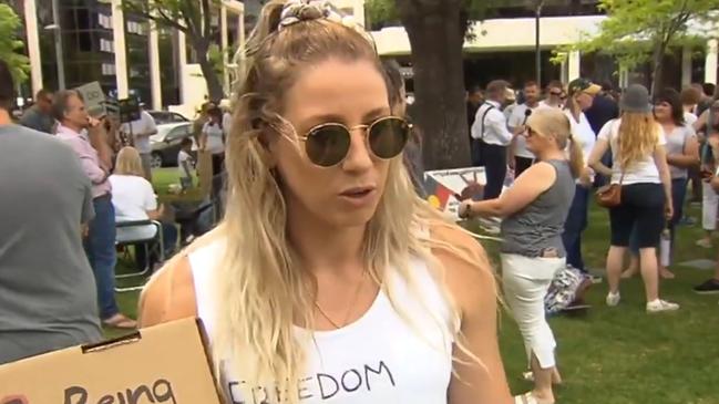 Adelaide AFLW player Deni Varnhagen at a protest against mandatory Covid vaccinations for SA Heath workers. Picture: 7 NEWS