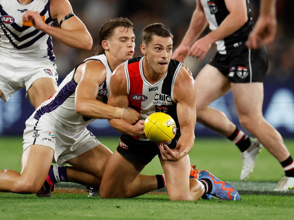 MELBOURNE, AUSTRALIA - MARCH 19: Jack Steele of the Saints is tackled by Caleb Serong of the Dockers during the 2023 AFL Round 01 match between the St Kilda Saints and the Fremantle Dockers at Marvel Stadium on March 19, 2023 in Melbourne, Australia. (Photo by Michael Willson/AFL Photos via Getty Images)