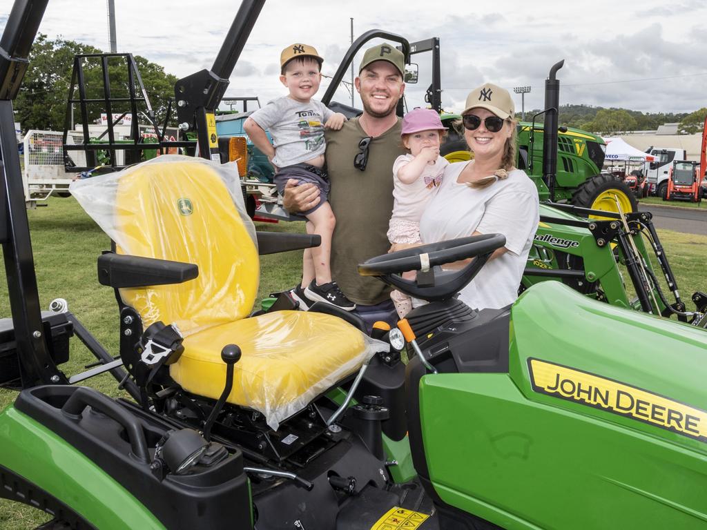 Cooper, Corey, Madelynn and Kate Goostrey checking out the tractor display at the Toowoomba Royal Show. Saturday, March 26, 2022. Picture: Nev Madsen.