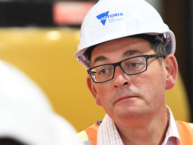 Victorian Premier Daniel Andrews (right) addresses the media at the A'Beckett Street Melbourne Metro Tunnel construction site in Melbourne's CDB, Wednesday, November 28, 2018. The Premier inspected the new road header machine which will aid the construction of the State Library train station. (AAP Image/James Ross) NO ARCHIVING