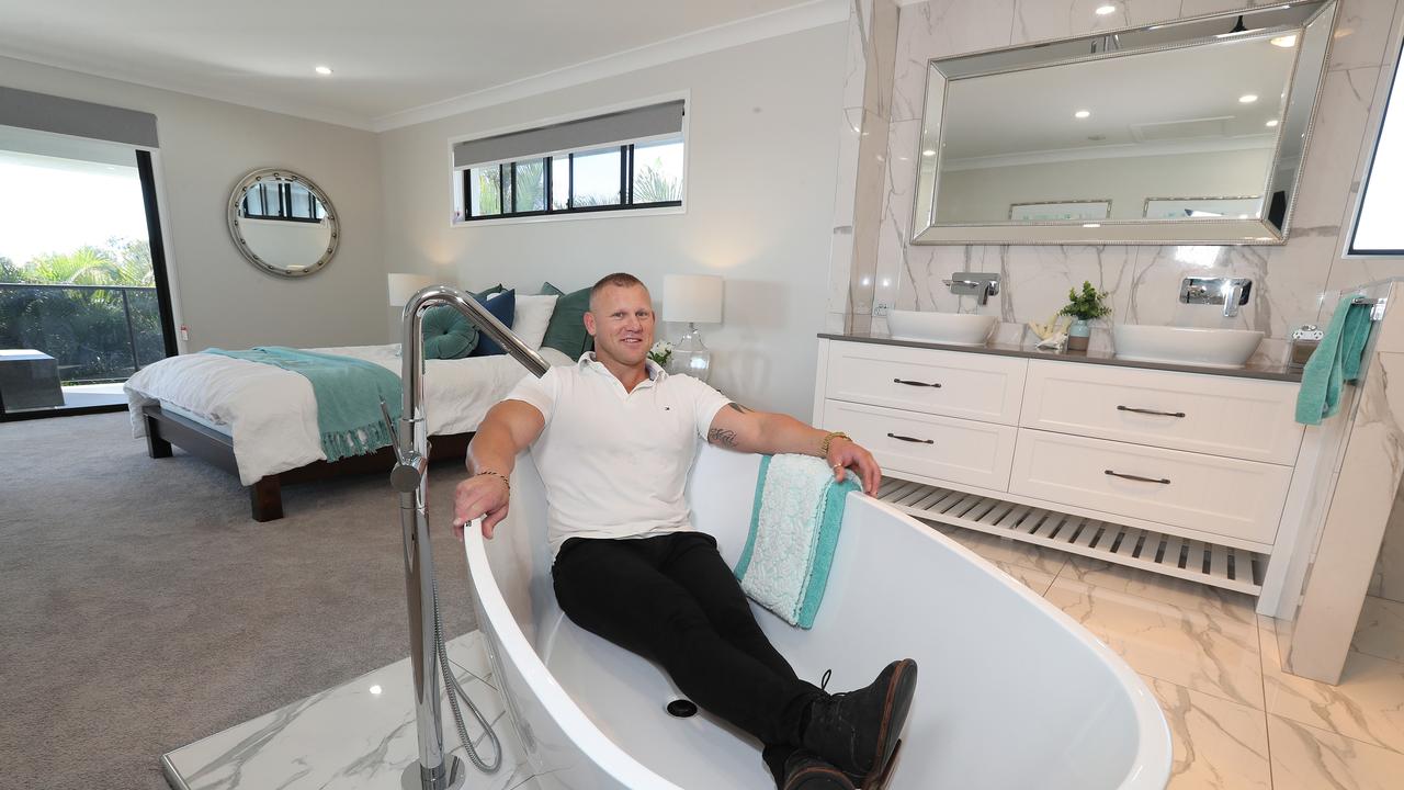 Troy Williamson at the renovated house in Wynnum where the master bedroom has an ensuite with no walls. Pic Annette Dew