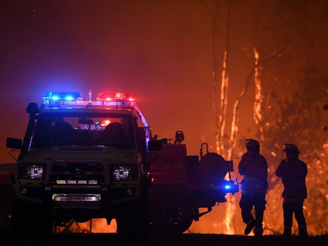 NSW Rural Fire Service crews protect properties as the Wrights Creek fire approaches Mangrove Mountain north of Sydney, December 5, 2019. Picture: AAP/Dan Himbrechts