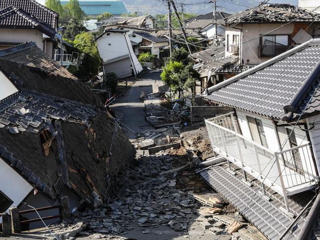 KUMAMOTO, JAPAN - APRIL 16: Houses are seen destroyed after a recent earthquake on April 16, 2016 in Kumamoto, Japan. Following a 6.4 magnitude earthquake on April 14th, the Kumamoto prefecture was once again struck by a 7.3 magnitude earthquake, killing 9 people. (Photo by Taro Karibe/Getty Images)