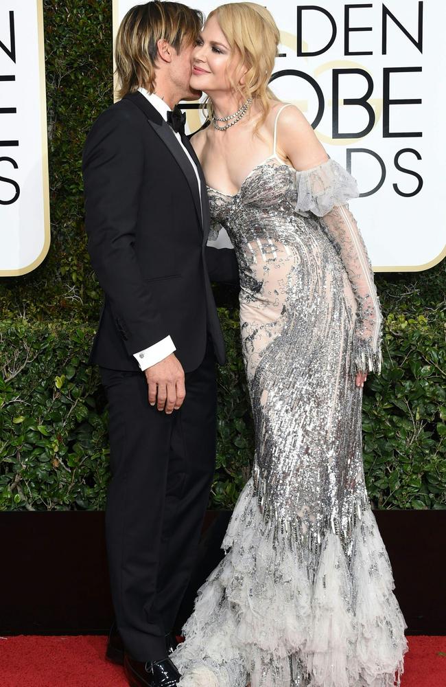 Nicole Kidman cosies up to husband Keith Urban at the Golden Globes. Picture: AFP/Valerie Macon