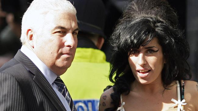 Amy Winehouse with her father Mitch, at Westminster Magistrates Court.