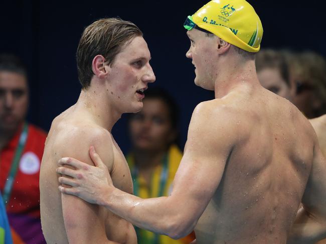 Horton and David McKeon congratulate each other after their opening swims.