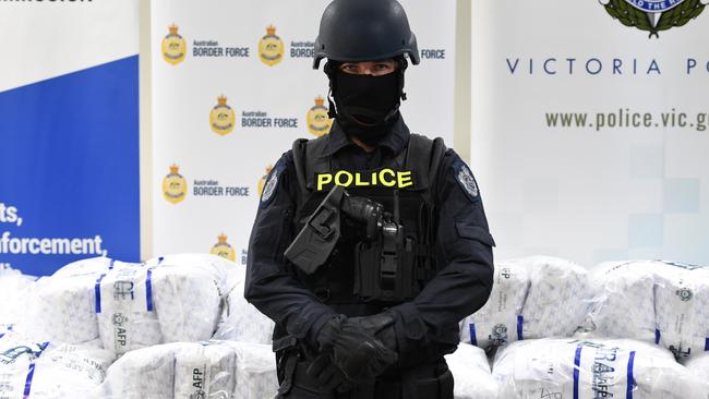 Australian Federal Police guard pseudoephedrine, a key ingredient in methamphetamine, during a press conference in Melbourne. Picture: AAP