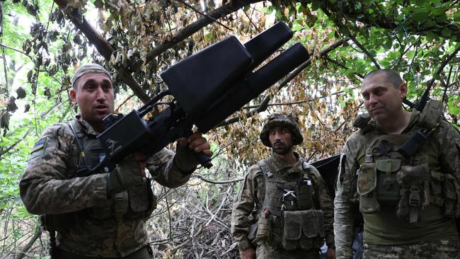 Ukrainian soldiers of the 28th Separate Mechanized Brigade prepare an anti-drone gun at the front line near the town of Bakhmut, Donetsk region. Picture: AFP