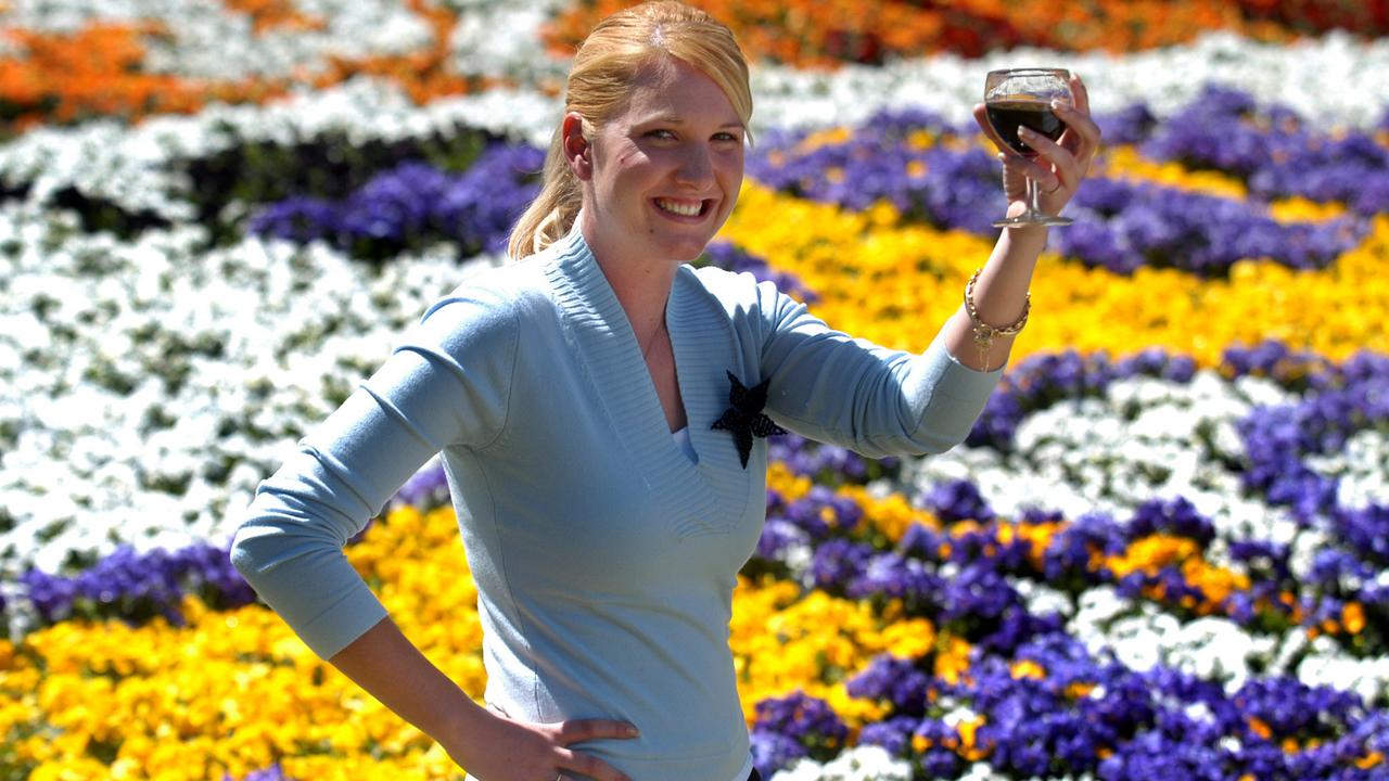 Stacey Morton 22yrs recently moved here and is looking forward to her first 'Carnival of Flowers' in Toowoomba. Stacey enjoying a glass of red wine at Laurel Bank Park. Picture: David Martinelli.