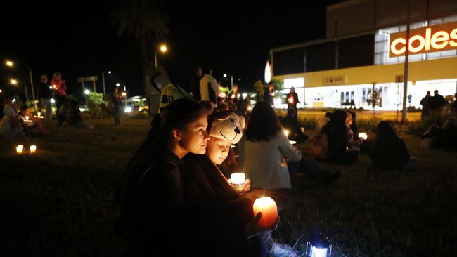 Claudia and Ella Yakubchak at a candlelight vigil held at the shopping centre the night of the accident. Picture: AAP/Josh Woning