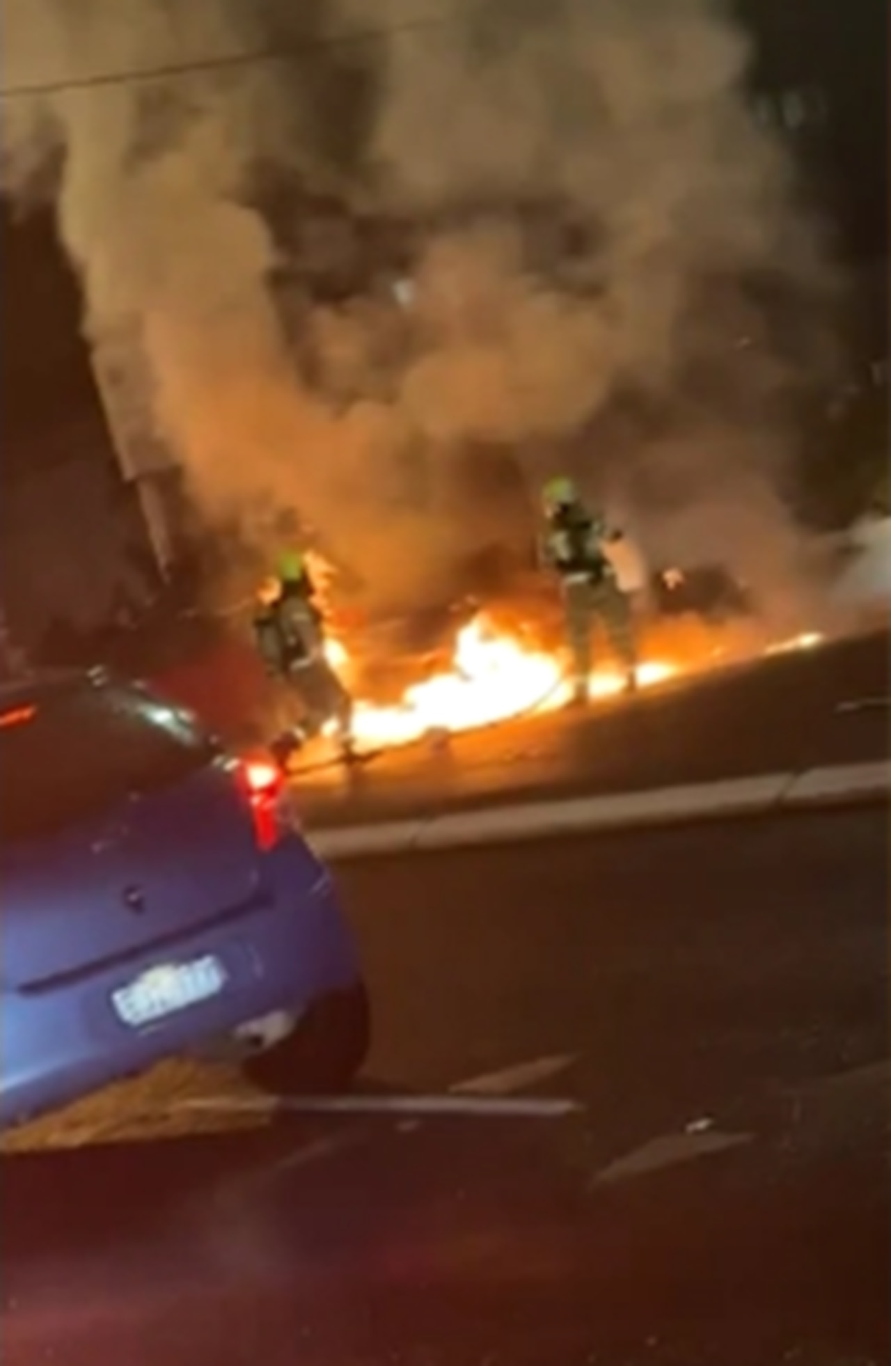 Firefighters worked through the night to extinguish the flames on the burning car. Picture: 7 News