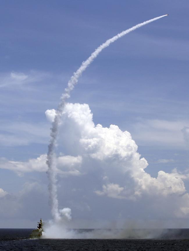 A Chinese missile frigate launches an air-defense missile during a military exercise earlier this month. Picture: Xinhau