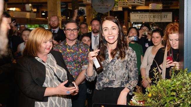 Jacinda Ardern buys barbecue sauces during a walkabout at Riverside Market in Christchurch. Picture: Getty Images.