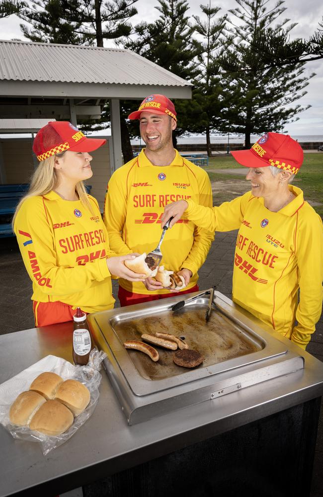 Aimee Charles, Callum Hawkins and Sarah Flynn all of Coogee SLSC cooking at Coogee beach. They will be cooking a bbq for the King of England on his visit to the NSW Community event in Parramatta. Picture: Daily Telegraph / Brendan Read