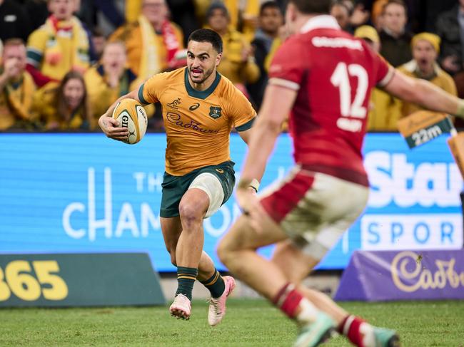 Wallabies fullback Tom Wright on his way to an outstanding individual try. Picture: Brett Hemmings/Getty Images