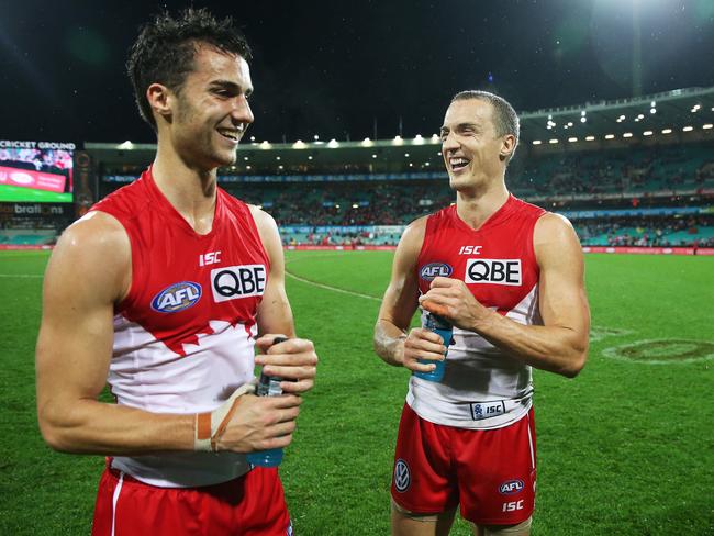 Xavier and Ted Richards enjoy a laugh after Xavier’s AFL debut. Picture: Phil Hillyard