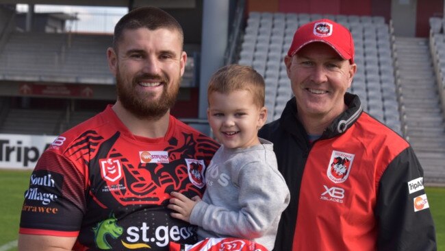 Dragons forward Mitchell Allgood with his son Peter and coach Paul McGregor after the jersey presentation for Allgood’s club debut.