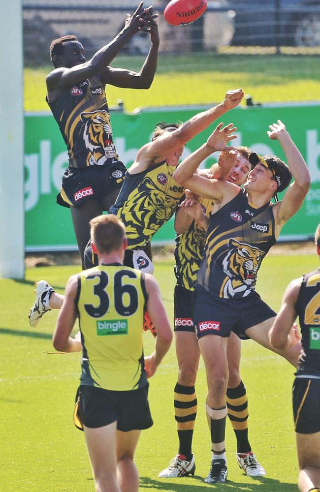 Mabior Chol shows off his huge leap in a Richmond trial game. Picture: Hamish Blair