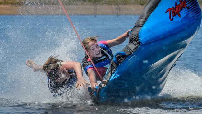 Grace Price, and Gracie Tomlin, both 14, get wet and wild at the Lake Eppalock Holiday Park near Bendigo in central Victoria. Picture: Jay Town