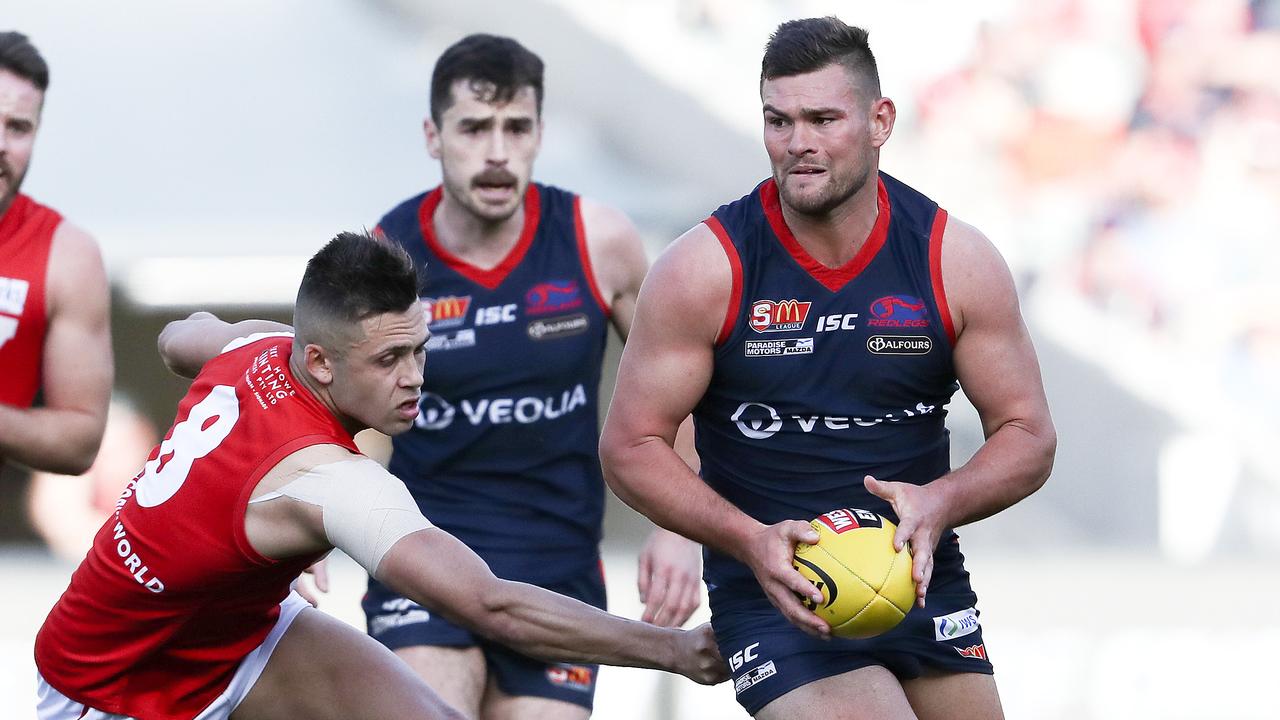 23/09/18 - SANFL - Grand Final - Norwood v North Adelaide at the Adelaide Oval. Mitch Grigg tries to out run Robert Young. Picture SARAH REED