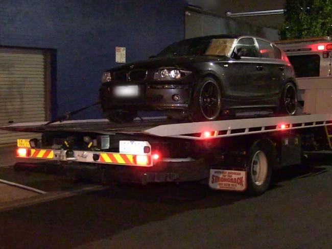 Police tow away a BMW in relation to the Coburg hit-run. Source: Victoria Police