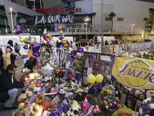 Fans at a memorial for Kobe Bryant in front of Staples Center in Los Angeles. Picture: AP