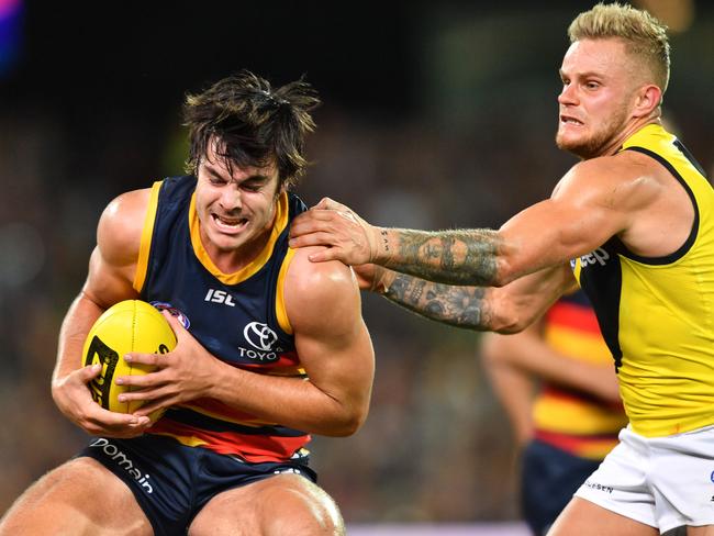 Darcy Fogarty of the Crows is tackled by Brandon Ellis of the Tigers during the Round 2 AFL match between the Adelaide Crows and the Richmond Tigers at Adelaide Oval in Adelaide, Thursday, March 29, 2018. (AAP Image/David Mariuz) NO ARCHIVING, EDITORIAL USE ONLY