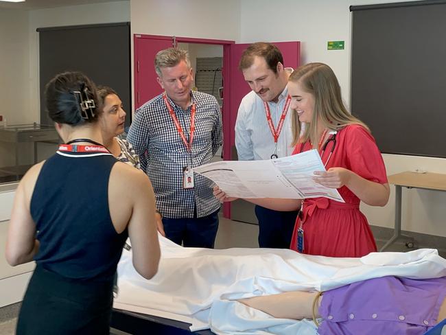 The new interns practice on an extremely sophisticated anatomically correct dummy. Photo: Fergus Gregg