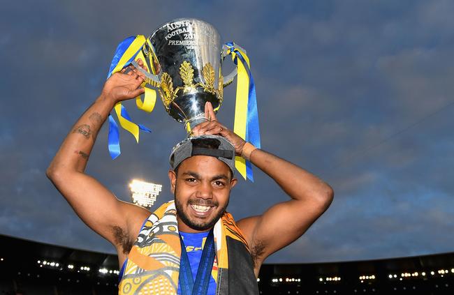 Willie Jr holds up the premiership cup after the Eagles won the 2018 AFL Grand Final against Collingwood. Picture: Quinn Rooney/Getty Images