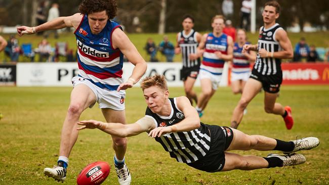 Todd Marshall dives in front of Central's Nicholas Madden in the SANFL last Saturday. Picture: AAP Image/Matt Loxton