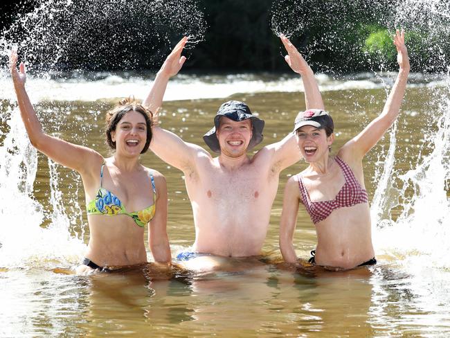 Sarah Beccari, Fergus Pilgrim and Eva Connor celebrate the new year in the Yarra River in Warrandyte. Picture: David Caird