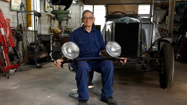 Frank Cerutti and his vintage 1929 AC Chevrolet currently undergoing restorations in his workshop. Picture: Evan Morgan