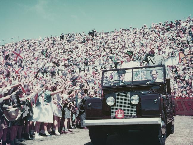 Queen Elizabeth II and Prince Philip wave to the crowd whilst on their Commonwealth visit to Australia, 1954. (Photo by Fox Photos/Hulton Archive/Getty Images)