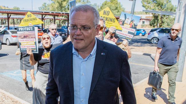 Prime Minister Scott Morrison was heckled by angry protesters in Alice Springs. Picture: Jason Edwards