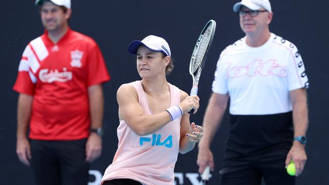 Ash Barty practising under the watchful eye of coach Craig Tyzzer (right) and partner Gary Kissick (left). Picture: Michael Klein.