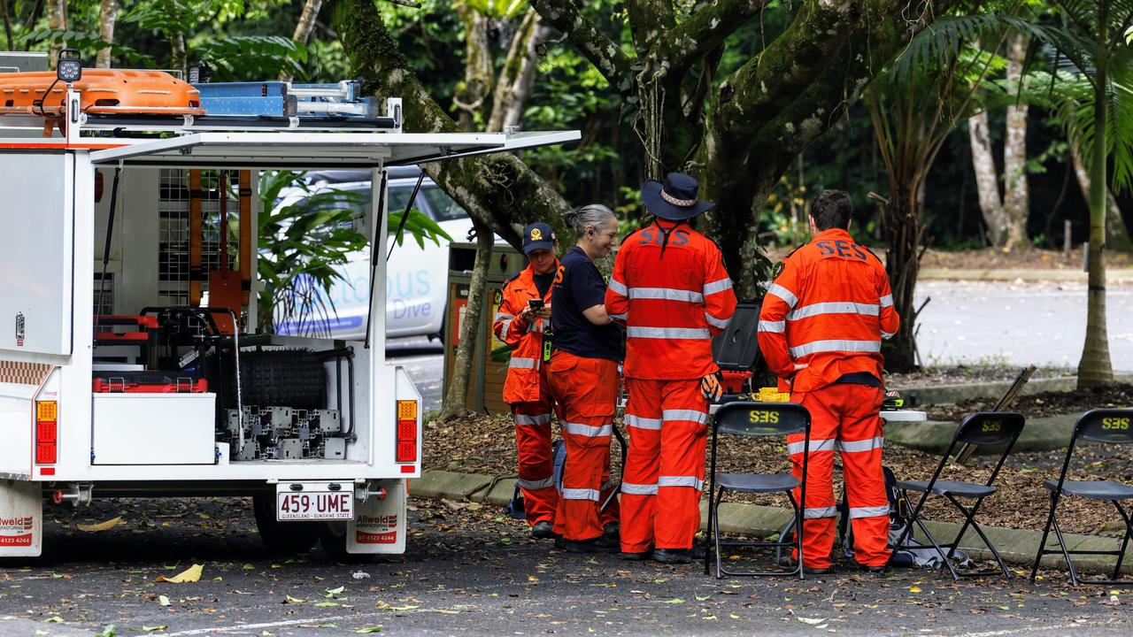 Queensland Fire and Emergency Services, State Emergency Services and police coordinating a search for the missing man at Crystal Cascades swimming hole in the Redlynch Valley. Picture: Brendan Radke