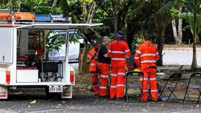 Queensland Fire and Emergency Services, State Emergency Services and police coordinating a search for the missing man at Crystal Cascades swimming hole in the Redlynch Valley. Picture: Brendan Radke