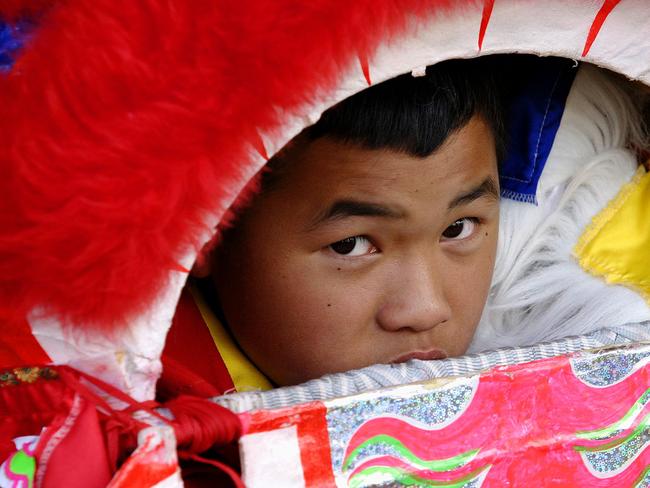 The dancing dragon takes a lunch break at the Cabramatta moon festival in 2005. Picture: James Horan