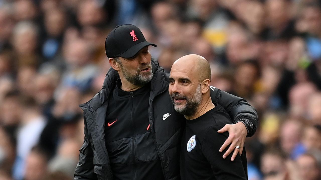 MANCHESTER, ENGLAND – APRIL 10: Pep Guardiola, Manager of Manchester City interacts with Jurgen Klopp, Manager of Liverpool during the Premier League match between Manchester City and Liverpool at Etihad Stadium on April 10, 2022 in Manchester, England. (Photo by Michael Regan/Getty Images)