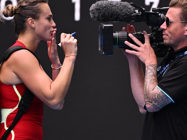 Belarus' Aryna Sabalenka blows a kiss for the camera after victory against Ukraine's Lesia Tsurenko in their women's singles match on day six of the Australian Open tennis tournament in Melbourne on January 19, 2024. (Photo by WILLIAM WEST / AFP) / -- IMAGE RESTRICTED TO EDITORIAL USE - STRICTLY NO COMMERCIAL USE --