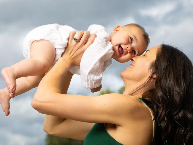 MELBOURNE, OCTOBER 24, 2024: Lara Scott, pictured with daughter Elsie, 8 months. Cancer survivor Lara Scott was diagnosed with a rare type of thyroid cancer shortly after her first-baby Ada was born and fought it twice.When she was pregnant with her second daughter, Elsie, in February this year, she felt unwell and went to the emergency department - where she then had a heart attack. She was eventually diagnosed with an extremely rare - and unrelated to her first - type of cancer which impacted her adrenaline levels - causing the heart attack. She would not have bothered to seek help that night if she hadn't been pregnant - she was worried for her baby and feared it was pre-eclampsia. Her baby Elsie saved her life. Picture: Mark Stewart